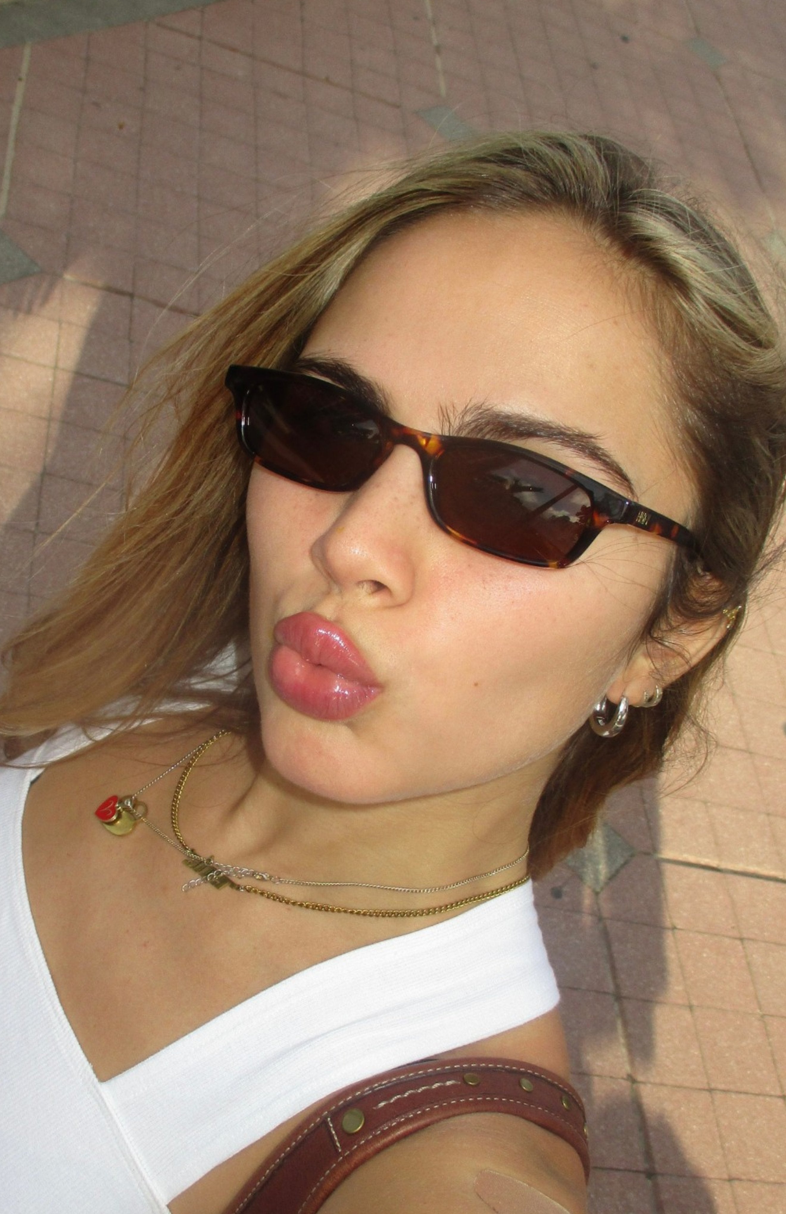 Person wearing sunglasses with a blurred background