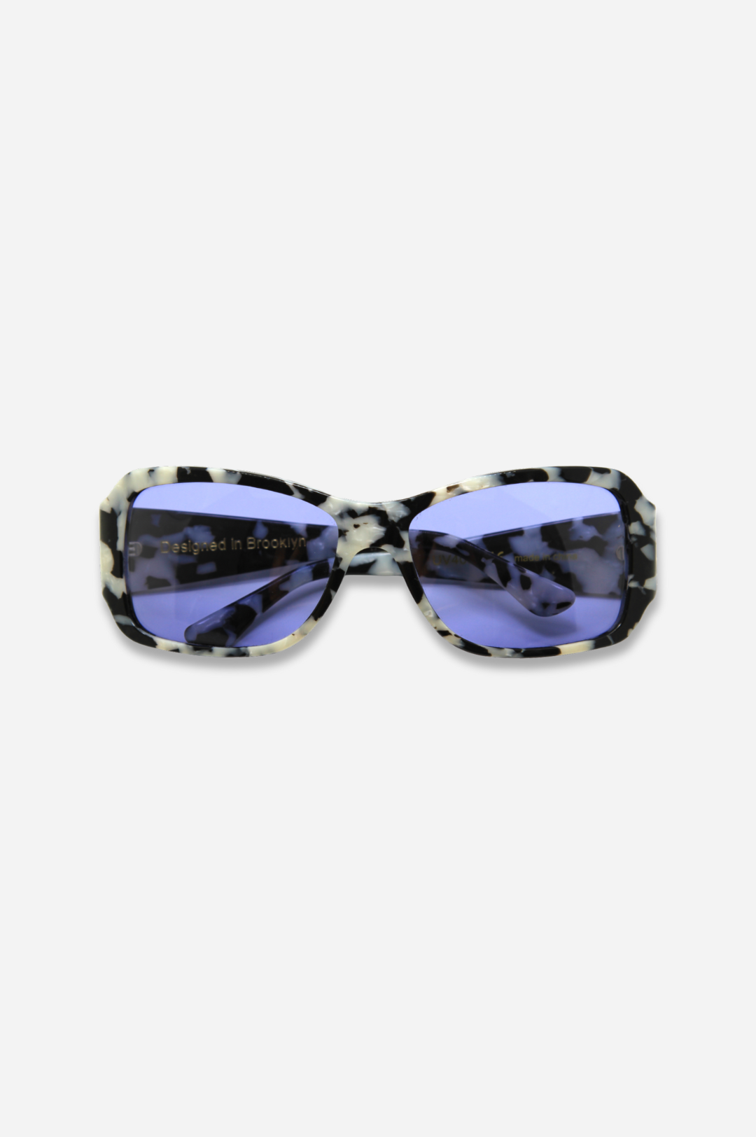 Sunglasses with a patterned frame and blue lenses on a white background