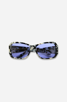 Sunglasses with a patterned frame and blue lenses on a white background