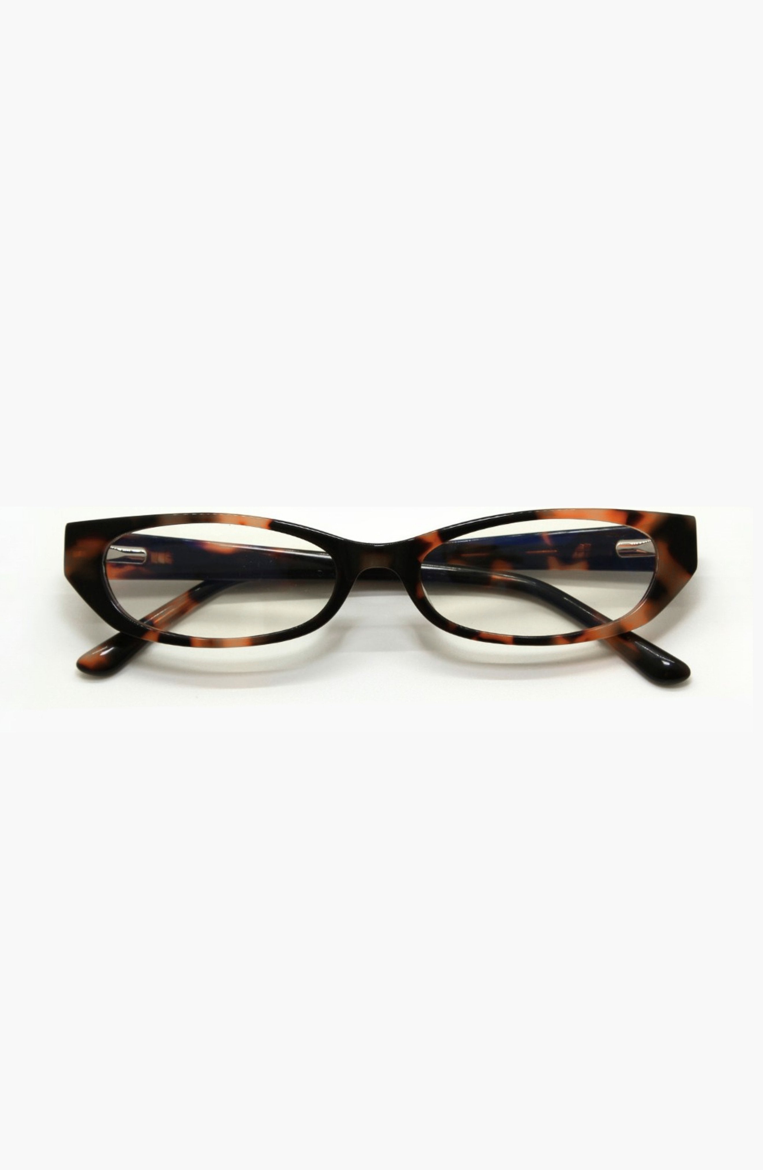 Tortoiseshell cat-eye glasses on a white background