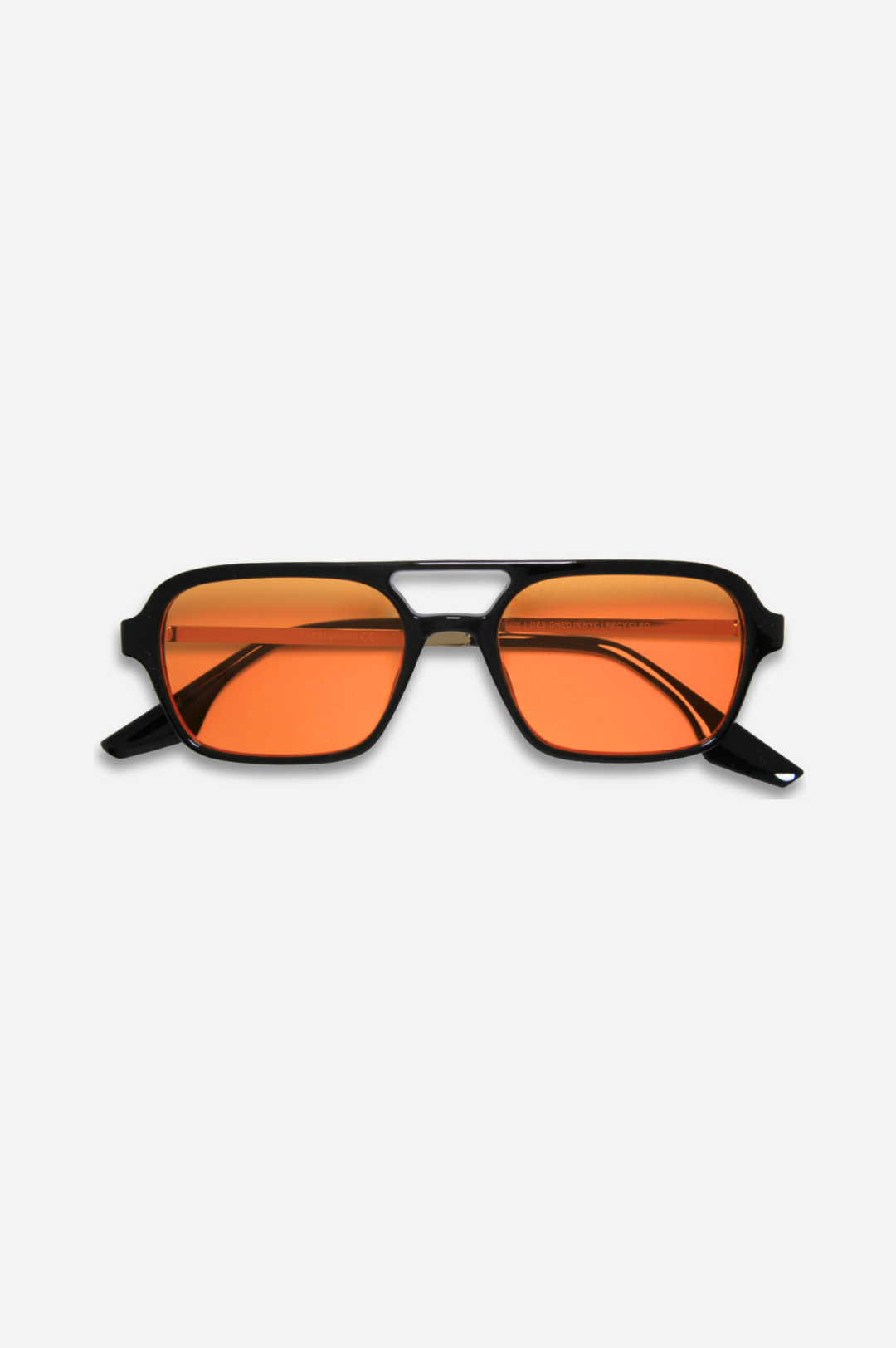Sunglasses with orange lenses and black frames on a white background