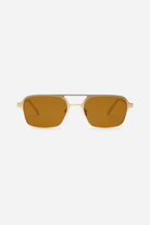 Gold-framed sunglasses with brown lenses on a white background