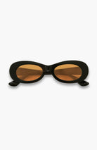 Black cat-eye sunglasses with brown lenses on a white background
